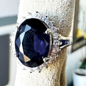 Deep purple/blue ring with cubic, zirconia surround